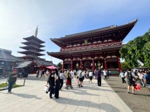 Visitors walking through Senso-ji Temple in Asakusa, Tokyo