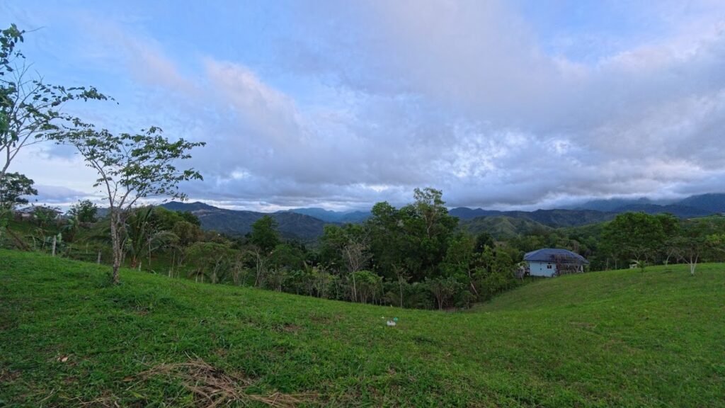 Wide view of green mountains and open grass fields in Tanay, Rizal.