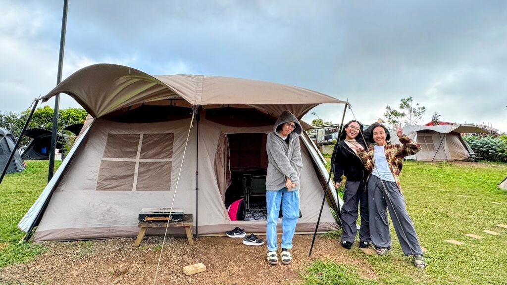 Family members posing in front of a camping tent in Tanay, Rizal.