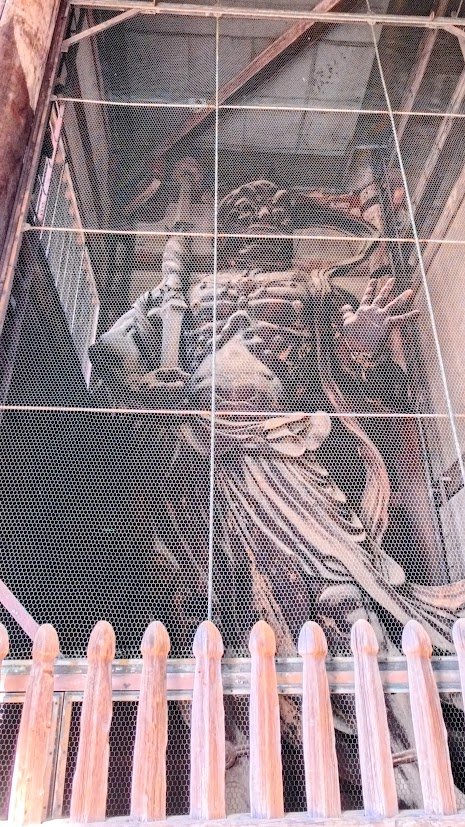 Large historical sculpture display inside a museum in Nara, Japan.
