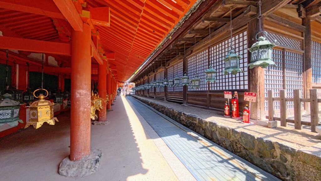 Traditional wooden corridor with hanging lanterns at Todaiji Temple in Nara, Japan.