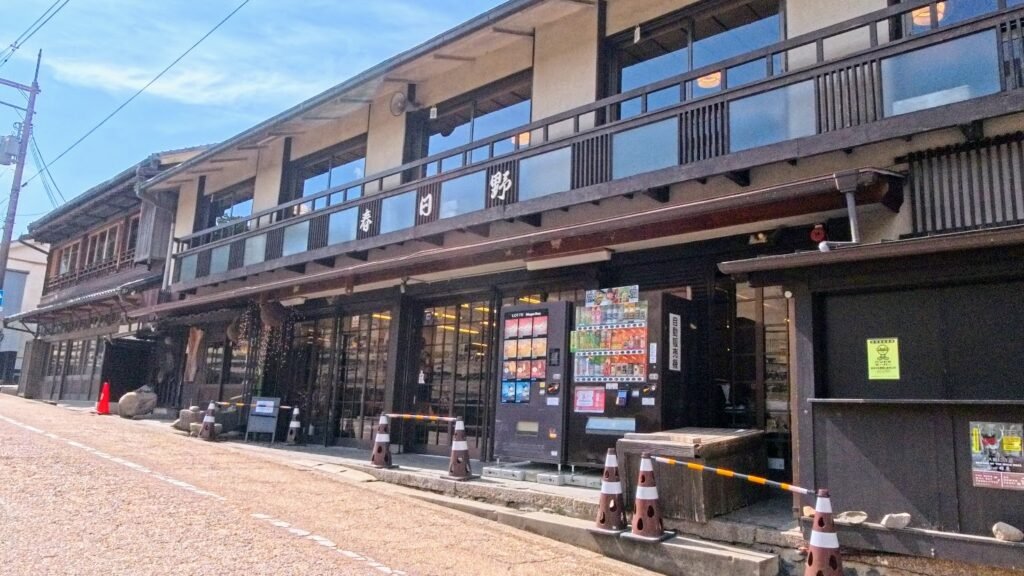 Traditional Japanese buildings and shops along a quiet street in Nara, Japan.