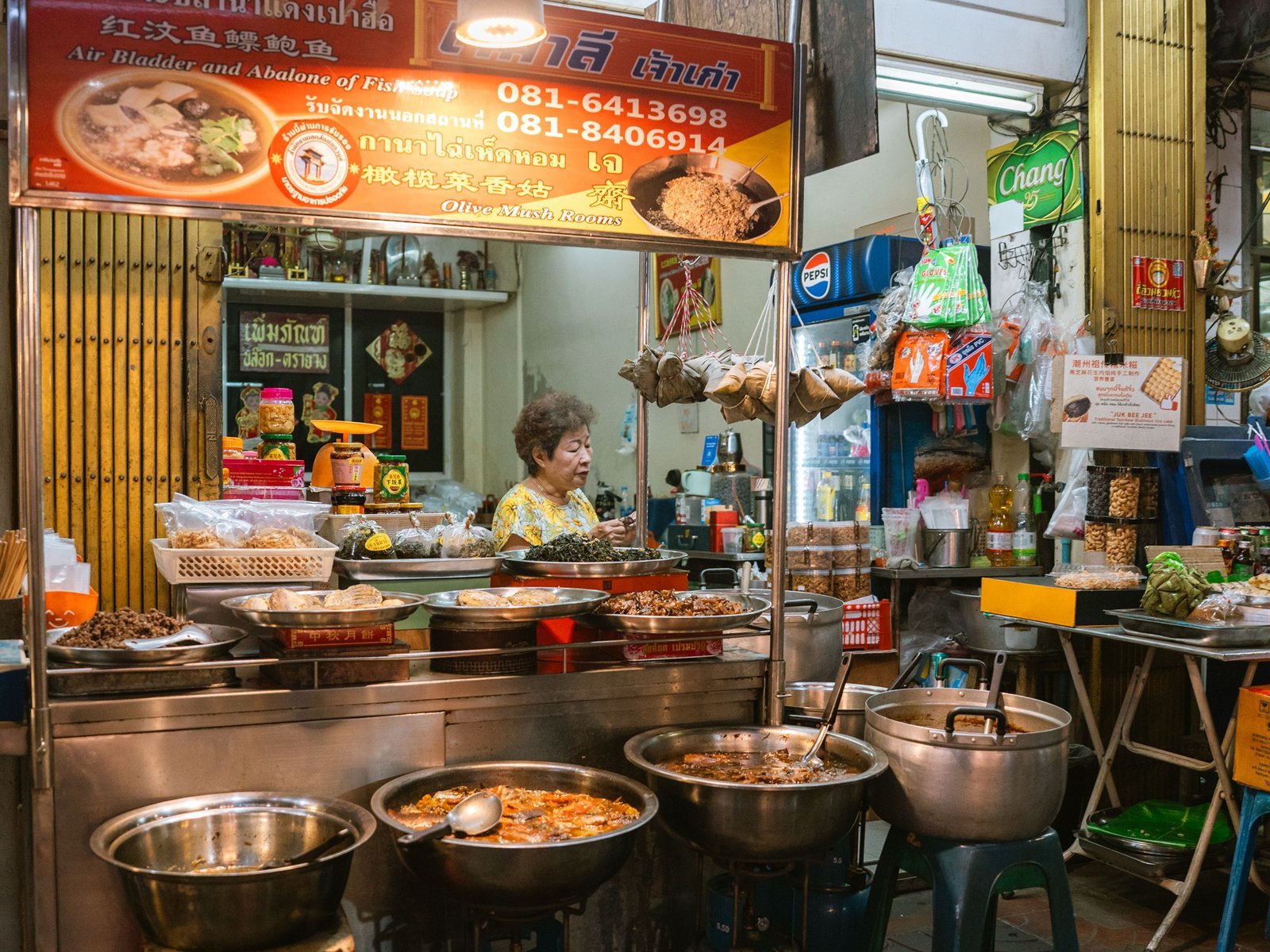 Street-food stall preparing Thai dishes at night in Bangkok
